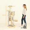 A woman and a cat stand next to a tall cat tree with dimensions labeled. Náhled obrázku produktu