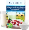 A product box for SUCOFIN Magermilchpulver, with images of milk, yogurt with strawberries, and a field with cows. Produktbild-Vorschau