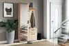 A hallway with a wardrobe, a plant, and a staircase. Voir les images du produit