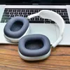 A pair of headphones rests on a laptop keyboard. Produktbild-Vorschau