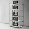 A metal shelving unit with weights on each shelf, set against a concrete wall. Náhľad obrázku produktu