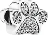 A close-up studio shot of a silver paw print charm with clear cubic zirconia stones. Anteprima dell’immagine prodotto
