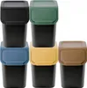 A set of five stackable trash cans with different colored lids, arranged in a grid. Produktbild-Vorschau