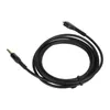 A black audio cable coiled on a white background. Podgląd zdjęcia produktu