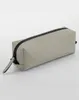 A light gray pencil case with a black zipper is shown against a light gray background. Voir les images du produit