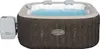 An inflatable hot tub filled with blue water, with a control unit attached to the side. Produktbild-Vorschau