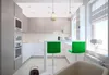 A modern kitchen with a breakfast bar and green stools. Produktbild-Vorschau