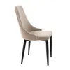 A side view of a beige upholstered chair with black legs, isolated on a white background. Produktbild-Vorschau