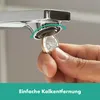A hand is using a coin to unscrew a faucet aerator. Anteprima dell’immagine prodotto