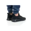 A person wearing black Puma Anzarun Lite running shoes and blue pants. Produktbild-Vorschau