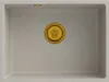 A top-down view of a beige sink with a gold drain. Podgląd zdjęcia produktu
