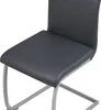 A close-up view of a modern gray dining chair with a sleek design. Produktbild-Vorschau