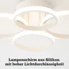 A close-up view of a modern, multi-ring LED ceiling light fixture. Podgląd zdjęcia produktu