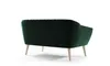 The back view of a dark green velvet couch with wooden legs, isolated on a white background. Náhľad obrázku produktu