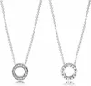 Two silver necklaces with circular pendants on a white background. Anteprima dell’immagine prodotto