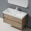 A bathroom vanity with a sink and faucet, mounted on a gray wall above a speckled floor. Anteprima dell’immagine prodotto