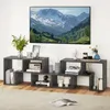 A living room scene with a TV stand and artwork. Náhled obrázku produktu