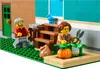 Two LEGO figures are in a garden setting next to a building. Produktbild-Vorschau