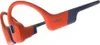 A pair of orange and blue Shokz sports headphones against a white background. Náhľad obrázku produktu