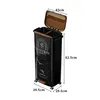 A black, multi-compartment trash can with a brown lid and wooden accents, shown with dimensions indicated. Produktbild-Vorschau