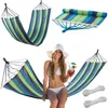 A collage of images showing a striped hammock, a rolled-up hammock, and a woman sitting in a hammock with drinks. Produktbild-Vorschau