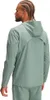 A man wearing a green hooded jacket and pants, viewed from the back. Produktbild-Vorschau