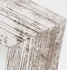 A close-up view of the corner of a wooden picture frame with a distressed white and brown finish. Podgląd zdjęcia produktu