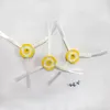 Three side brushes and two screws on a white background. Voir les images du produit