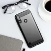 A smartphone case is displayed on a white surface next to a pair of glasses and a cup of coffee. Podgląd zdjęcia produktu