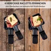 Two raclette pans filled with food, placed on a wooden surface. Produktbild-Vorschau