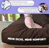 A hand pressing into a brown cushion, with text overlays describing features. Anteprima dell’immagine prodotto