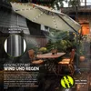 An outdoor patio scene with a large cantilever umbrella set up over a table and chairs, with rain and leaves depicted. Anteprima dell’immagine prodotto