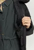A close-up shot of a person wearing a black jacket and a dark grey corduroy shirt. Produktbild-Vorschau