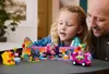 A father and daughter are playing with a LEGO set. Produktbild-Vorschau