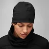 A woman wearing a black beanie and black turtleneck. Anteprima dell’immagine prodotto