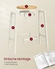 An exploded view of a bar stool assembly, showing individual parts labeled with letters and accompanied by assembly instructions. Produktbild-Vorschau