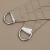 A close-up view of two D-rings attached to a beige fabric sail shade. Náhled obrázku produktu