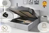 A bed with its storage compartment open, showcasing its features. Produktbild-Vorschau