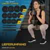 A woman is performing a squat exercise with a dumbbell, while a display of weight plates and dumbbell bars is shown on the left. Produktbild-Vorschau
