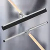 Two squeegees with wooden handles are shown against a blurred background. Náhled obrázku produktu