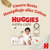 A product image of Huggies Extra Care diapers, featuring a baby and promotional text. Produktbild-Vorschau