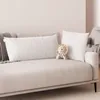 Two pillows and a stuffed lion are placed on a sofa. Produktbild-Vorschau