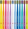 A collection of CURAPROX toothbrushes in various colors, arranged in a row against a white background. Náhled obrázku produktu