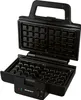 An open black waffle maker with its interior waffle grid visible. Produktbild-Vorschau