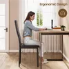 A woman is sitting at a desk, demonstrating good posture while using a laptop. The image highlights the ergonomic design of the chair. Anteprima dell’immagine prodotto