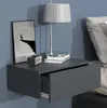 A wall-mounted nightstand next to a bed. Produktbild-Vorschau