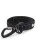A black dog leash coiled on a white background. Voir les images du produit
