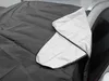 A close-up of a car windshield cover draped over the edge of a car door. Náhled obrázku produktu