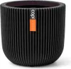 A black ribbed planter pot with an orange and white label. Produktbild-Vorschau