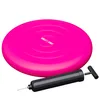 A pink balance cushion and a black hand pump on a white background. Produktbild-Vorschau
